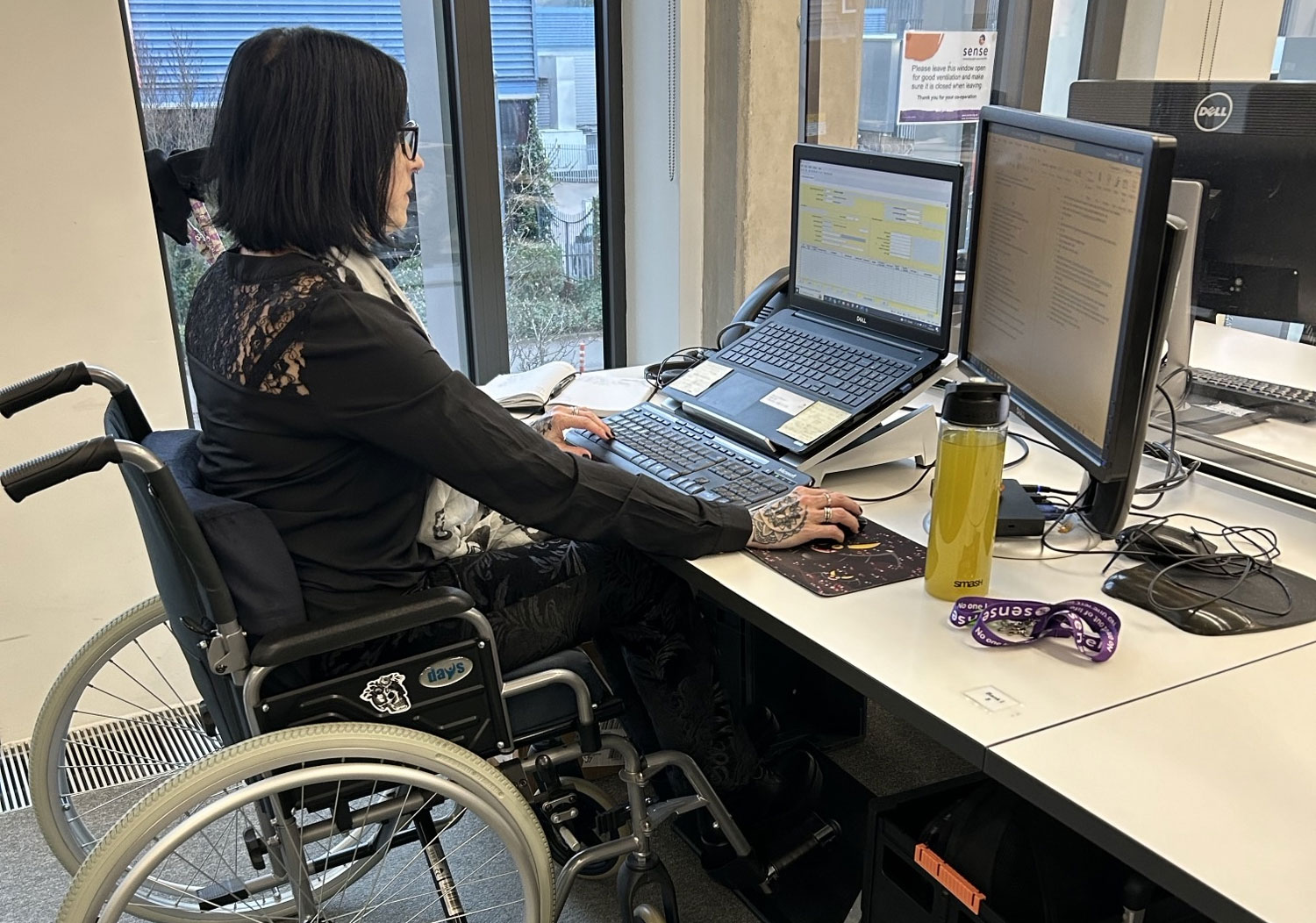 Vicky sits at her desk in the office